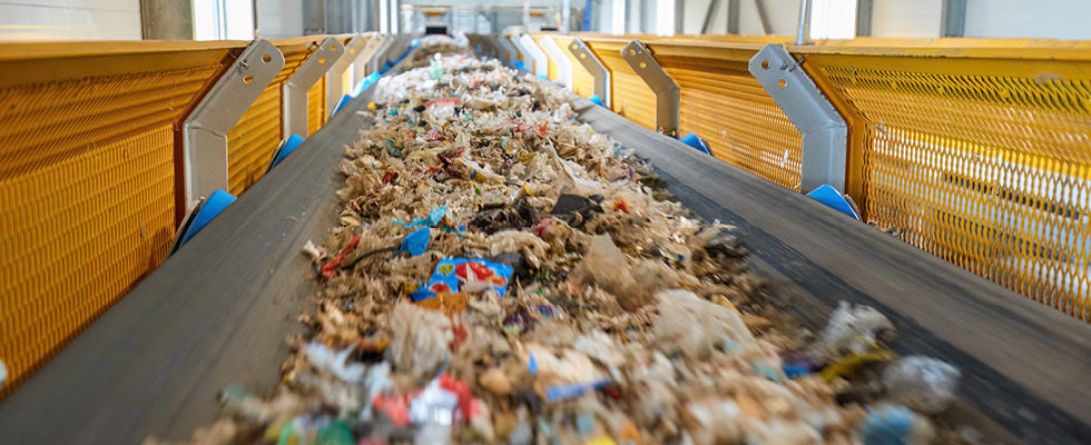 Trash on a conveyor belt on its way to the next part of recycling