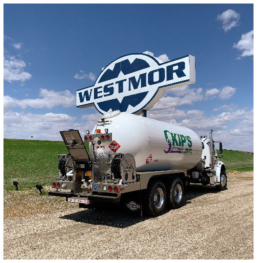 White bobtail truck parked under Westmor company sign