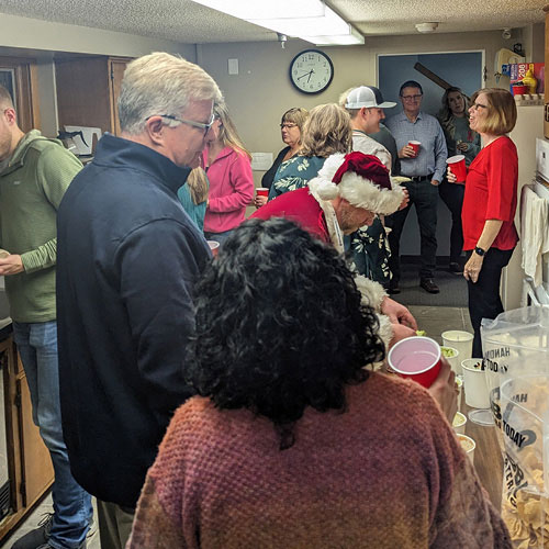 Coworkers at an in-person holiday event