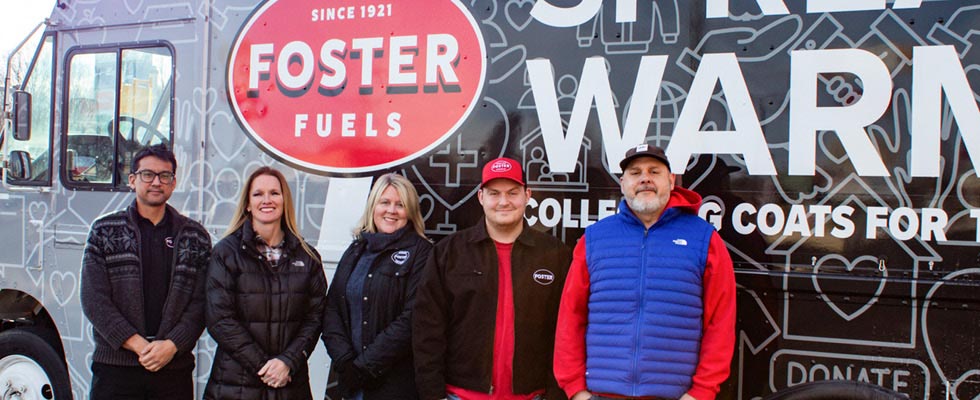 Representatives from Foster Fuels are pictured in front of their community service truck.