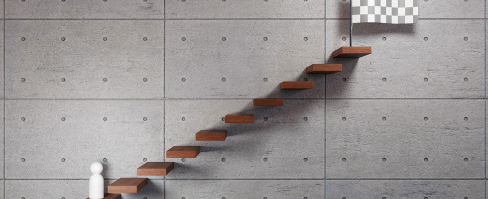 A graphic depicts a figure about to go up steps to a finish mark.