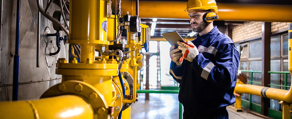 A professional checking on a meter