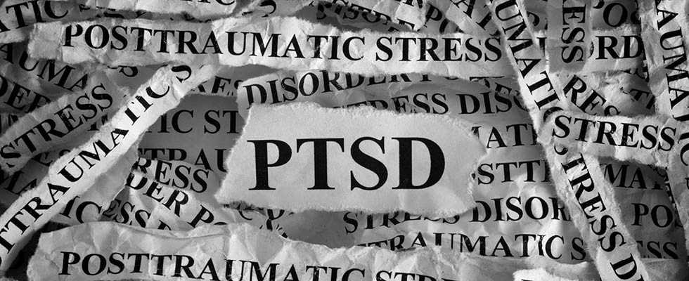 A picture features word clippings around the topic of "PTSD."