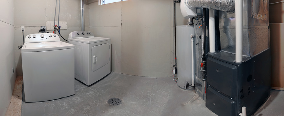 A picture shows a basement with a heating unit in place.