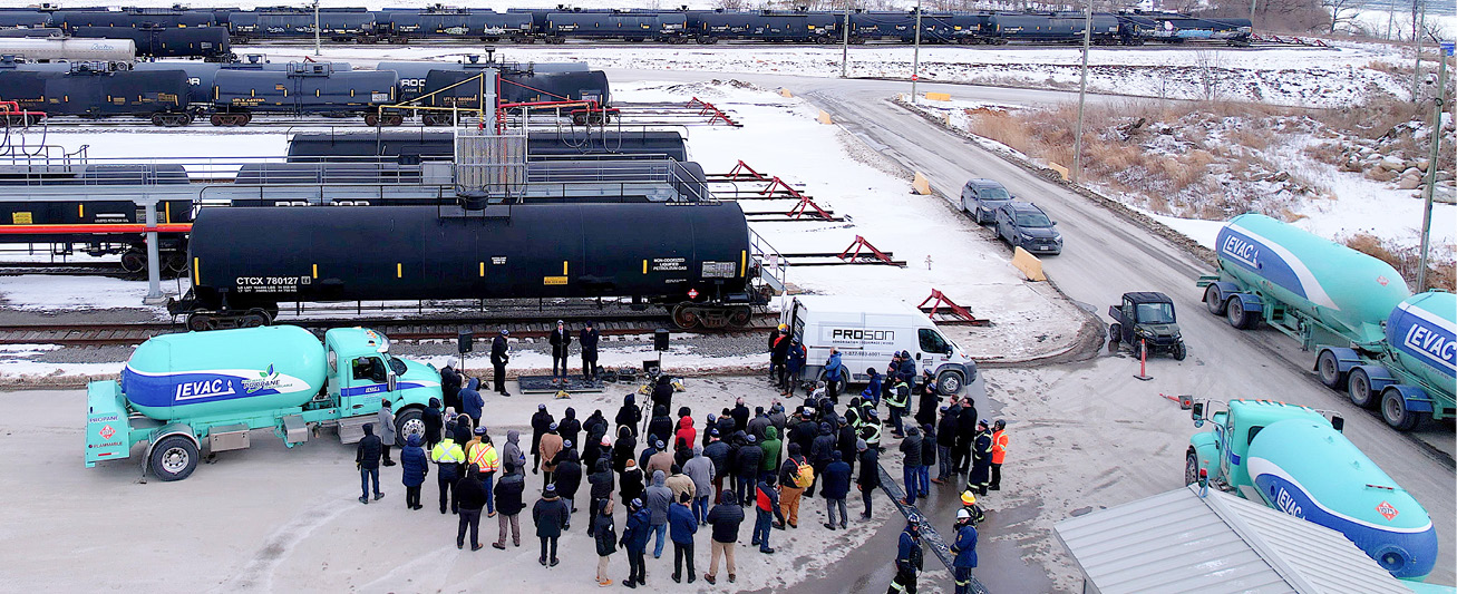 Attendees at the event look on as speeches commence at the terminal.