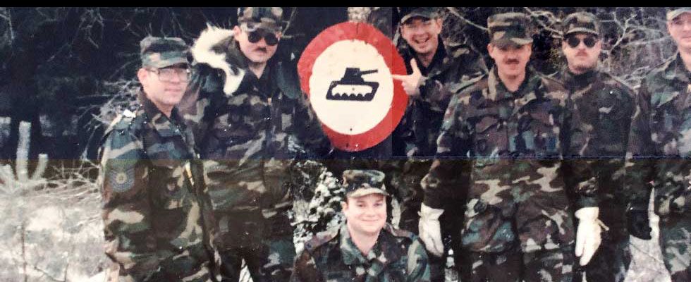 Tim Quinn smiling for the camera with fellow members of the Air Force